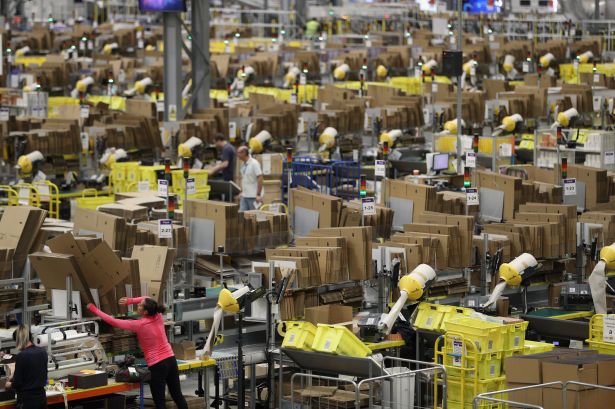 Humans and machines at work at an Amazon Fulfillment center.