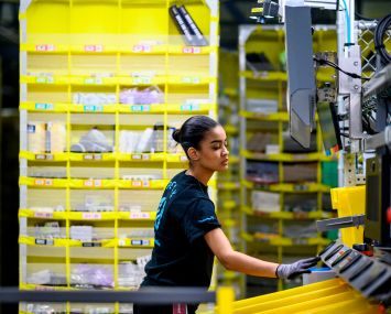 A woman at work in a logistics center.