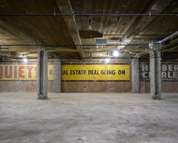 Contractors ripping off drywall on the fourth floor of 555 Fifth Avenue in Midtown discovered a vintage real estate ad that declared "QUIET! Big real estate deal going on."