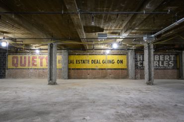 Contractors ripping off drywall on the fourth floor of 555 Fifth Avenue in Midtown discovered a vintage real estate ad that declared "QUIET! Big real estate deal going on."