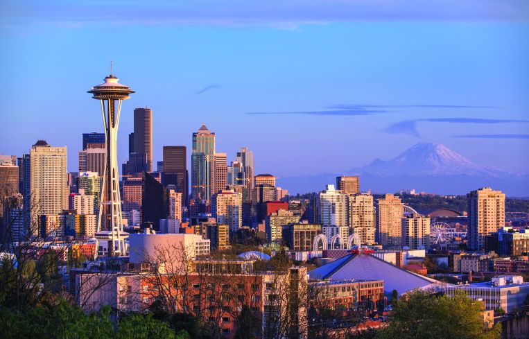 Seattle's iconic skyline with Mount Rainier in the distance.