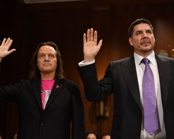 T-Mobile CEO John Legere (Ieft) and SoftBank Group and Sprint's Marcelo Claure. Legere is reportedly in talks to take over as CEO of WeWork.