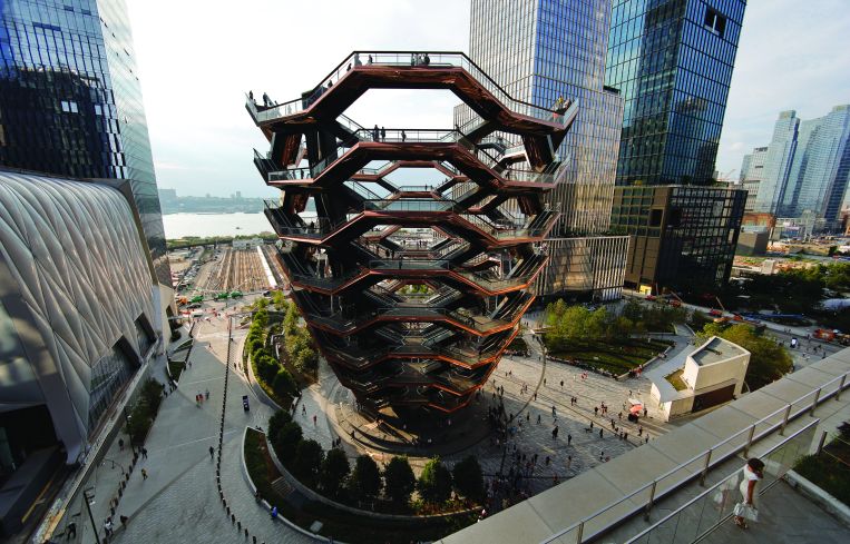 People walk on the Vessel at Hudson Yards on August 8, 2019 in New York City.