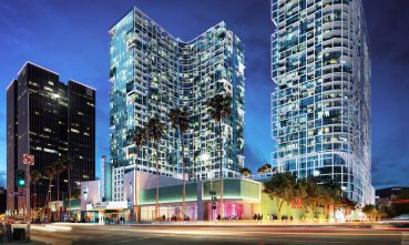 A rendering of the towers that are set to rise next to the headquarters of AIDS Healthcare Foundation, left, which opposed the project and sued the city over development in Hollywood.