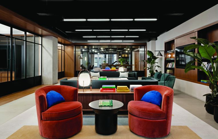 More mid-century modern arm chairs and couches in dark orange, royal blue and forest green.
