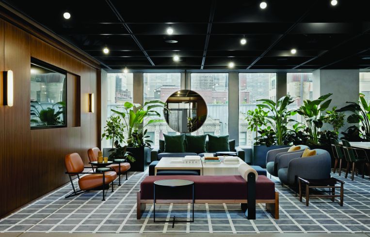 The space - inspired by when the tower was built in the late 1960s - includes typically mid century modern seating, round end tables, potted plants.
