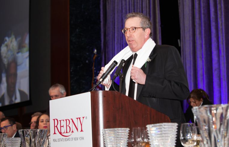William Rudin dons a signature white cashmere scarf as a tribute to Jay Kriegel.