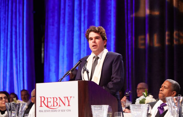 Jay Kriegel’s son, Connor, accepts the John E. Zuccotti Public Service Award on his behalf.
