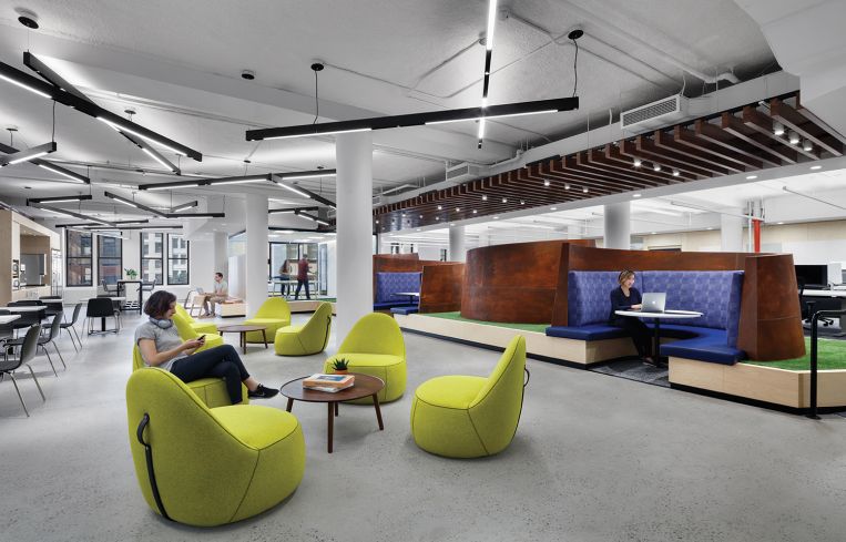 Richard Serra-inspired booths create an artistic feel in a lounge designed for Capital One's tech team.