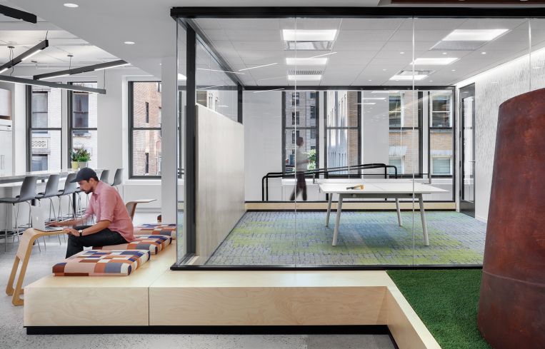 An elevated AstroTurf floor in the lounge is meant to be reminiscent of nearby Madison Square Park.