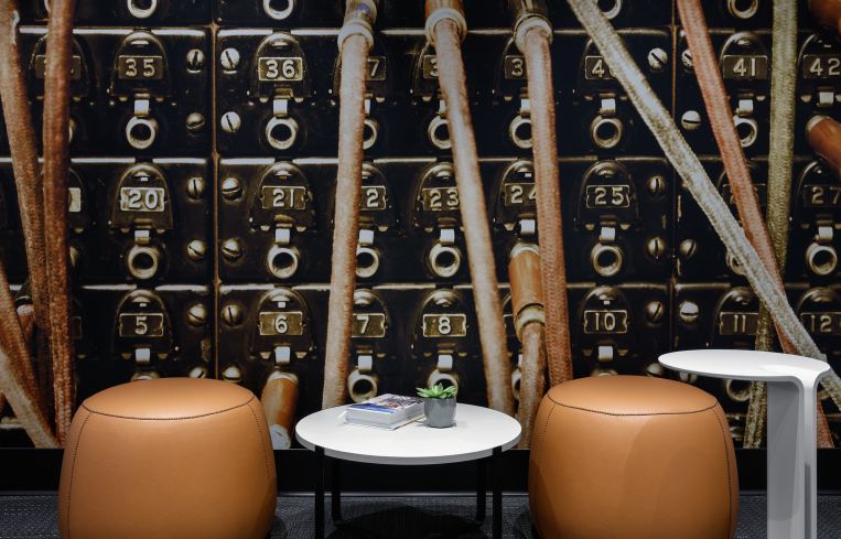 Sitting rooms were designed around the idea of old technology, like telephone switchboards.