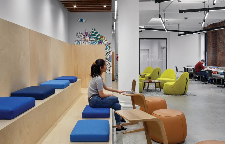 One lounge is designed with plywood bleachers for all hands meetings.