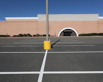 An empty parking lot at the Enfield Square Mall in Enfield, Conn.