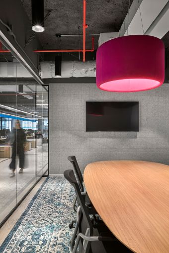 Light fixtures made of acoustic fabric help brighten spaces with fun colors and absorb sound in conference rooms and meeting areas.