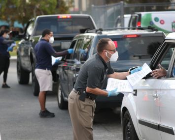 People Line Up For Unemployment Applications In Hialeah, FL During COVID-19 Crisis