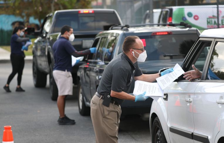 People Line Up For Unemployment Applications In Hialeah, FL During COVID-19 Crisis