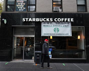 NEW YORK, NEW YORK - APRIL 24: A view of a Starbucks Coffee open only for mobile orders during the coronavirus pandemic on April 24, 2020 in New York City. COVID-19 has spread to most countries around the world, claiming over 196,000 lives lost with over 2.8 million infections reported. (Photo by Cindy Ord/Getty Images)
