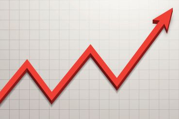 A photo of a red line graph rising.