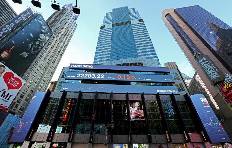 A very tall, glass building from the street level.