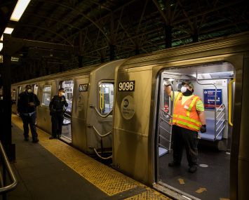 A worker disinfects a train at a subway station in Brooklyn.