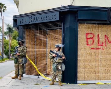 The Hundreds, a streetwear outlet at 501 Fairfax Avenue, is watched by National Guardsmen.