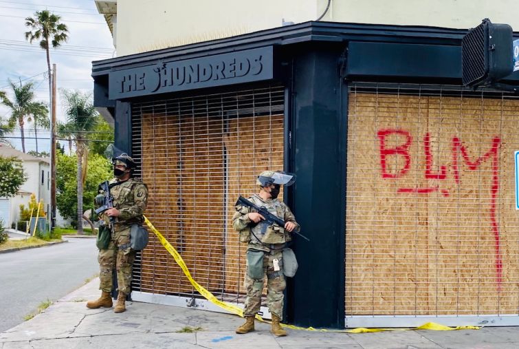 The Hundreds, a streetwear outlet at 501 Fairfax Avenue, is watched by National Guardsmen.