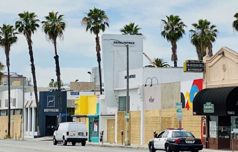 Dozens of stores along Melrose Avenue have been boarded up.