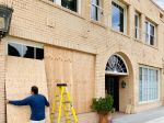 The store at 119 Larchmont is boarded up Tuesday.