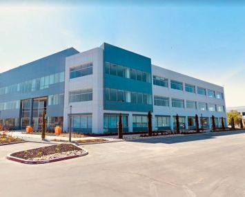 The property at 200 Holger Way in San Jose is one of the buildings leased to Raytheon and recently sold to EXAN Group. 100 Headquarters Drive is to the right.