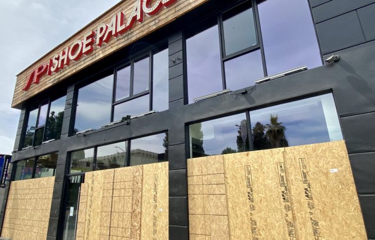 Shoe Palace at 7725 Melrose Avenue has been boarded up.