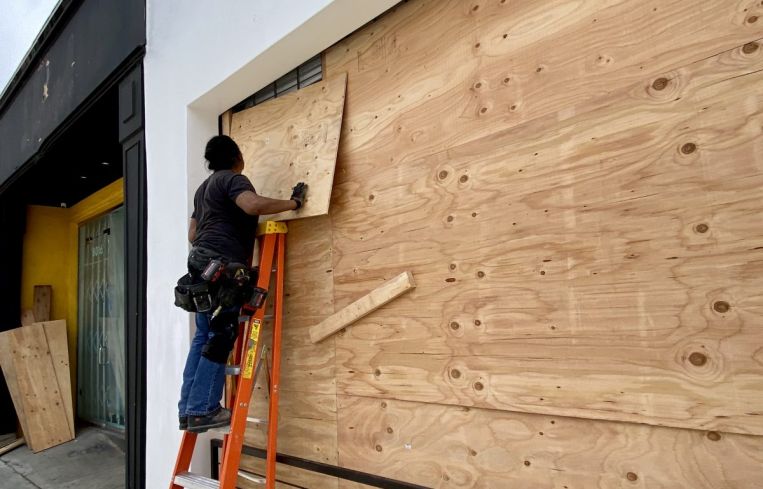 The store at 8020 Melrose Avenue is boarded up on June 2.