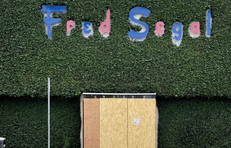 The iconic Fred Segal apparel store is boarded up at 8100 Melrose Avenue.