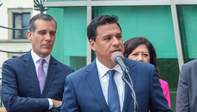 Councilman Jose Huizar, center, was arrested Tuesday.