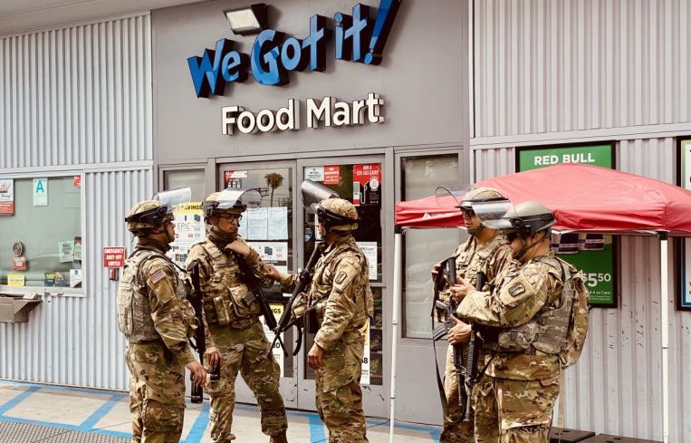 National Guardsmen congregate at a gas station at Melrose and Fairfax across from Fairfax High School.