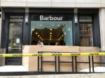 The exterior of a damaged Barbour store.