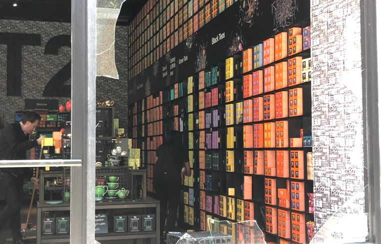 The inside of the looted T2 tea store, where workers were cleaning up.