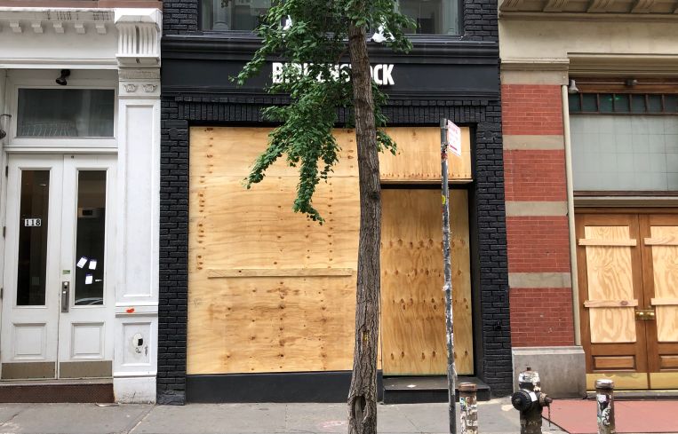 looted birkenstock boarded up
