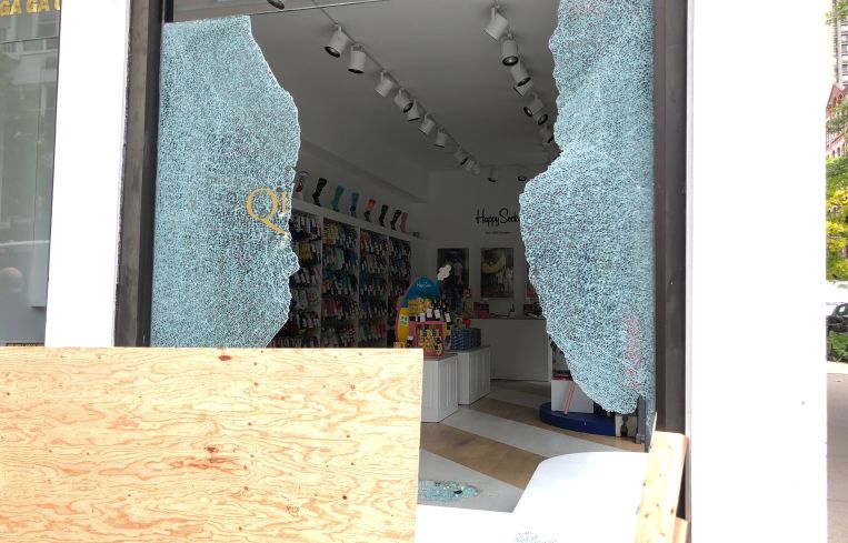 Inside Happy Socks, where an employee holds down the fort the night after the protests and looting.