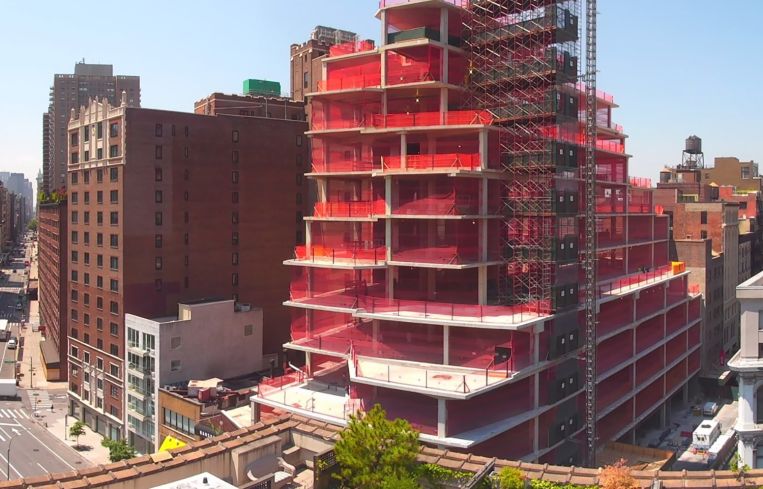 Workers are getting ready to attach facade panels on the building, which is scheduled to be complete next spring.