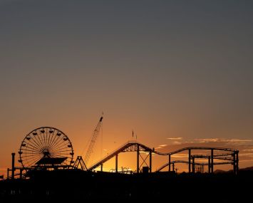Officials are recommending that counties cancel firework shows for the holiday, and that residents do not gather with people they do not live with. Above, Santa Monica Pier.