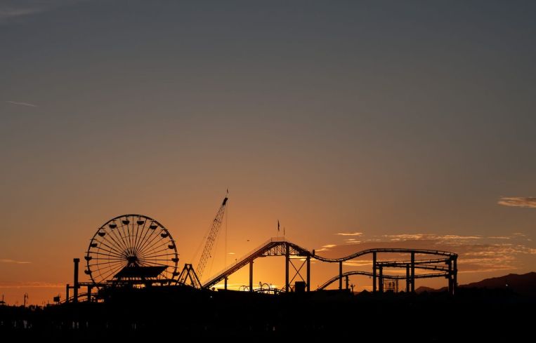 Officials are recommending that counties cancel firework shows for the holiday, and that residents do not gather with people they do not live with. Above, Santa Monica Pier.