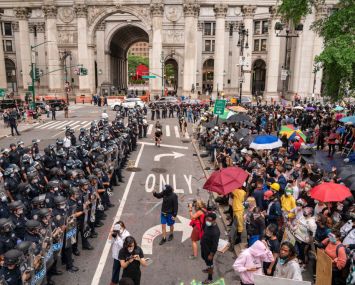 "Occupy City Hall" protesters pushing for less police funding and more funding for social safety net programs face off with the police near City Hall in Manhattan this morning.