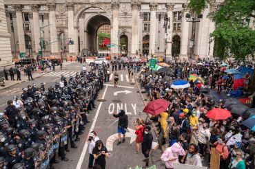 "Occupy City Hall" protesters pushing for less police funding and more funding for social safety net programs face off with the police near City Hall in Manhattan this morning.