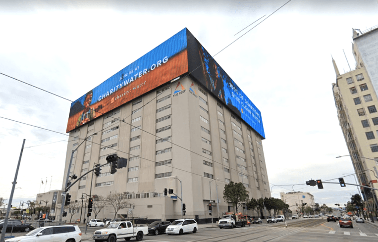 The three digital billboards wrap around the sides of the building, measuring about 55 feet by 245 feet.