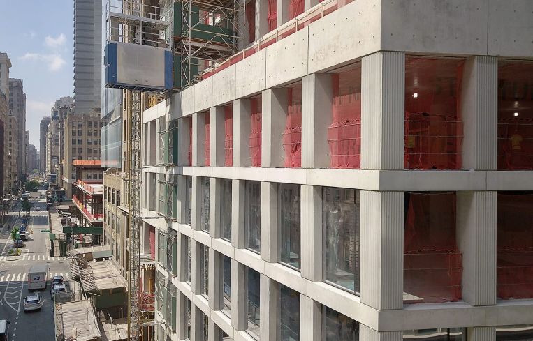 Glass is up to the third floor on the building's facade.