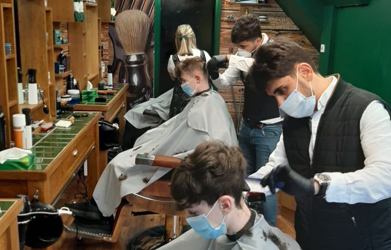 Barbershops and hair salons must practice physical distancing and use face coverings for both employees and customers.