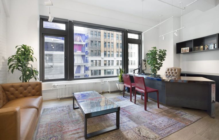 The space features midcentury modern furniture in addition to wood and metal finishes.
