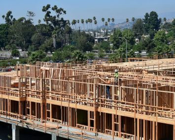 Construction workers build a multifamily in Los Angeles.