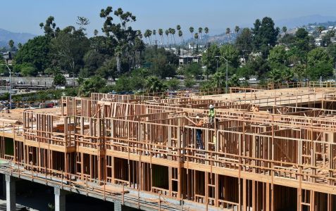 Construction workers build a multifamily in Los Angeles.