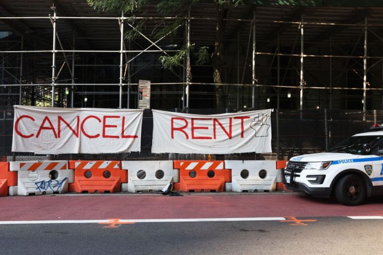 A banner sign on scaffolding that says "cancel rent."